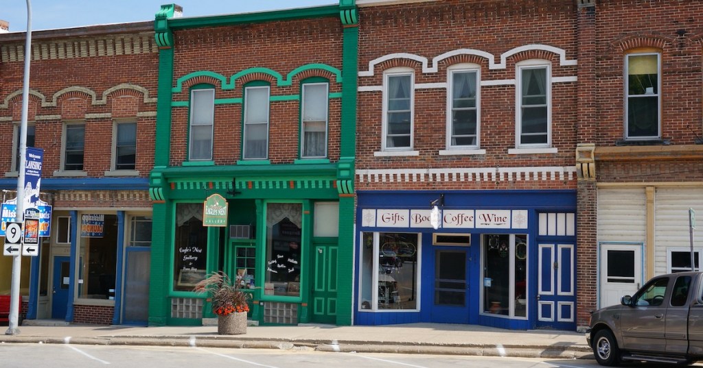 Colorful storefronts line Lansing, Iowa's historic, brick downtown district.