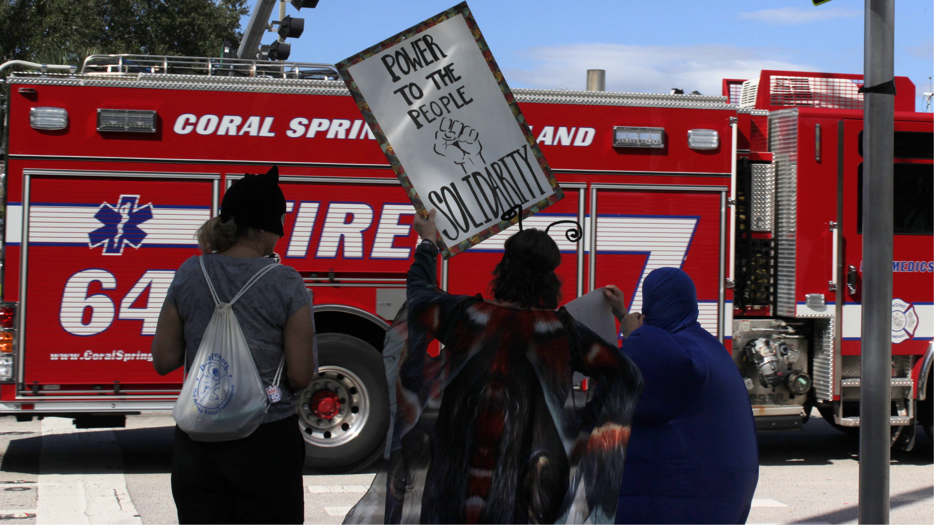 Small protest gathers in Coral Springs over civil rights, immigration ...