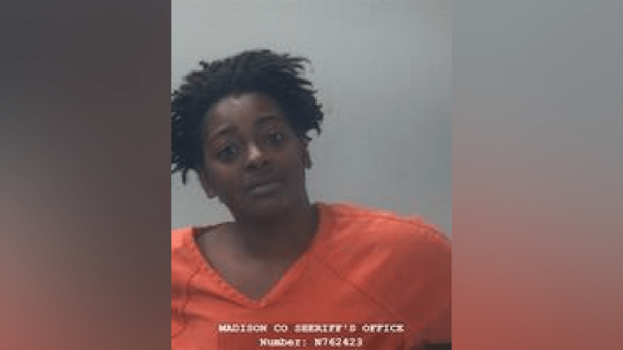 Woman arrested, charged with murder in August shooting
