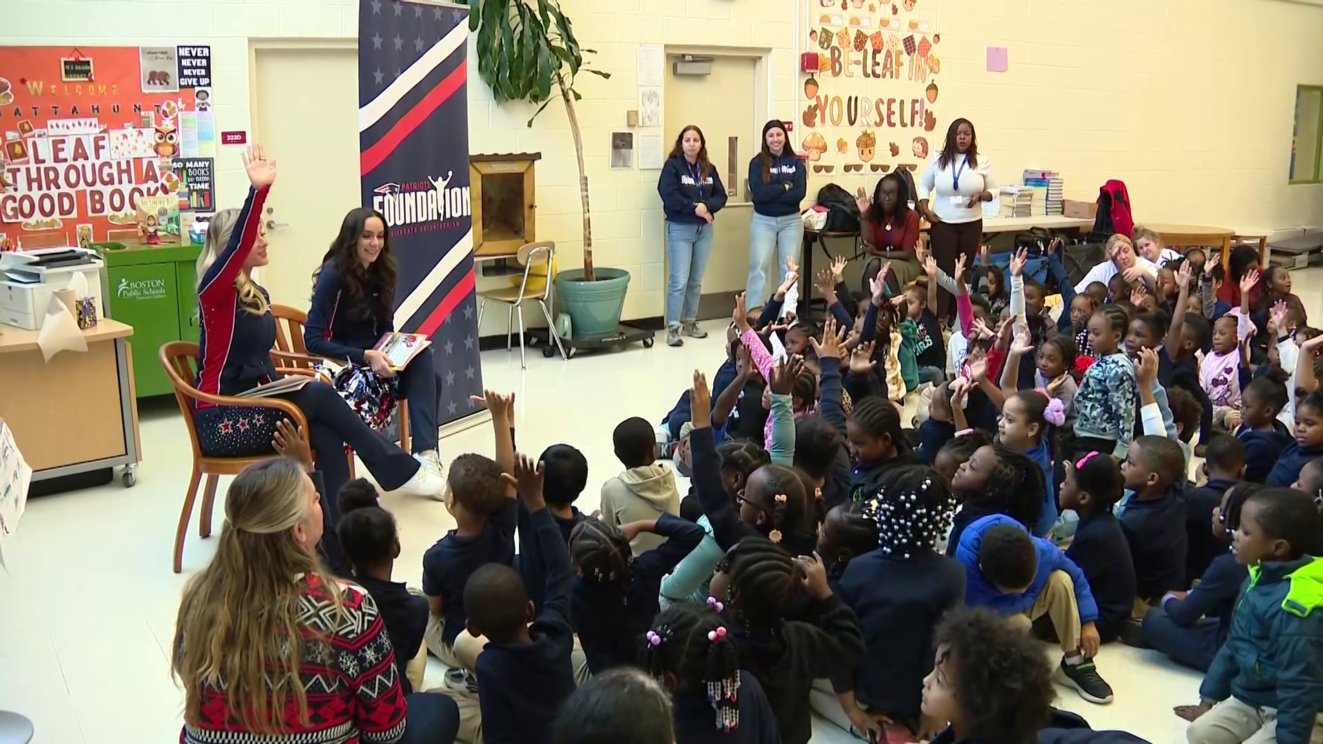 Patriots cheerleaders read to students at Boston elementary school