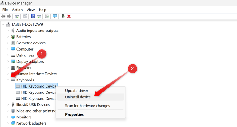 Uninstalling a keyboard device in Device Manager.
