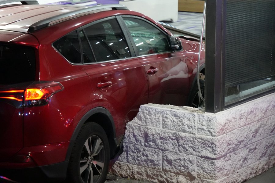 Car goes through store wall after crash in Centennial