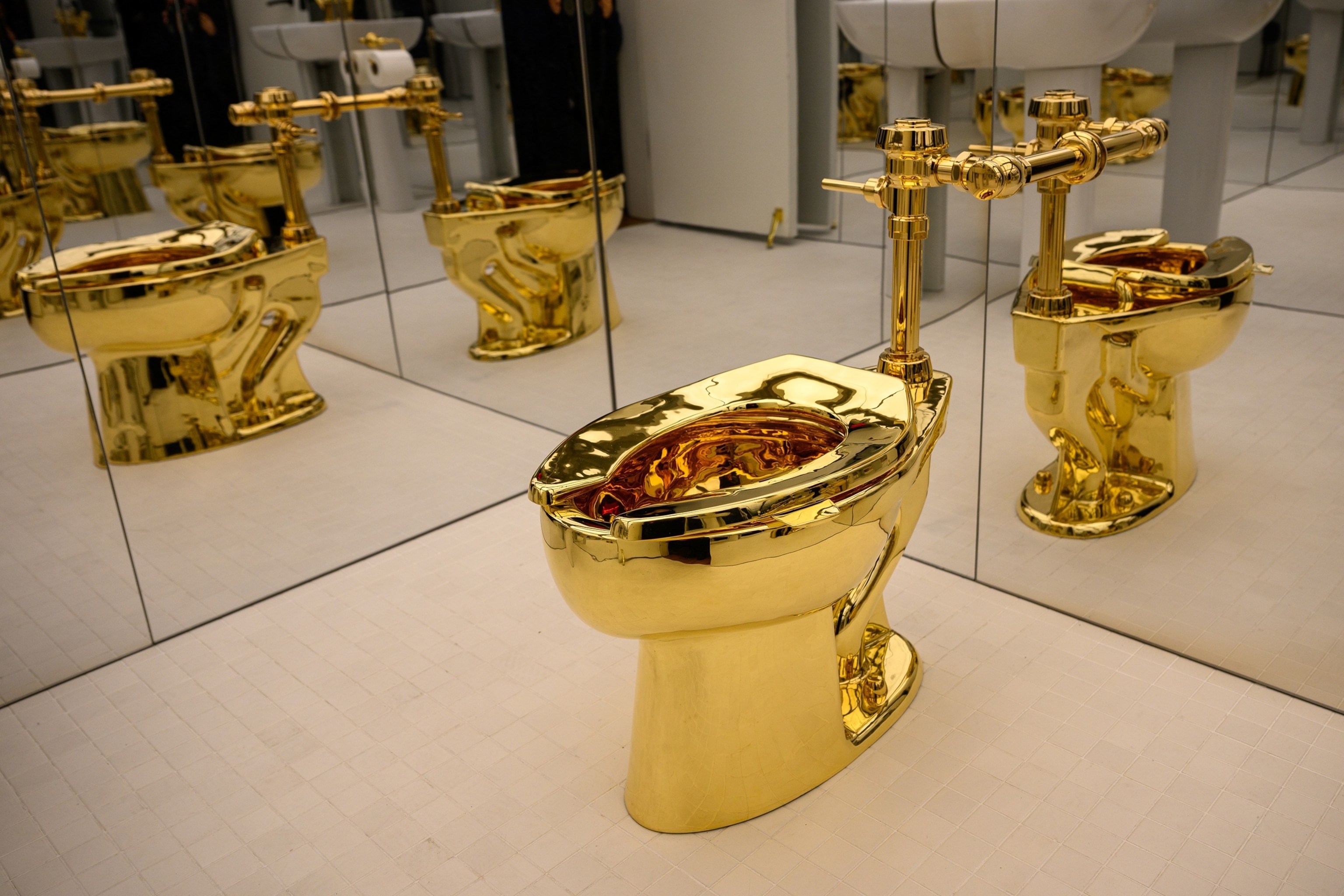 Solid gold toilet named 'America' sells at auction for $12M