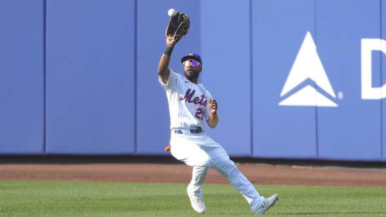 Sep 14, 2025; New York City, New York, USA; New York Mets center fielder Cedric Mullins (28) catches a fly ball hit by Texas Rangers center fielder Wyatt Langford (36) (not pictured) during the tenth inning at Citi Field. Mandatory Credit: Gregory Fisher-Imagn Images | Gregory Fisher-Imagn Images