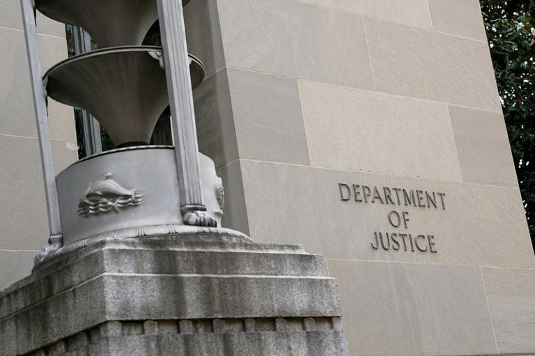 Former FBI employee sues DOJ says unjustly fired over Pride Flag display