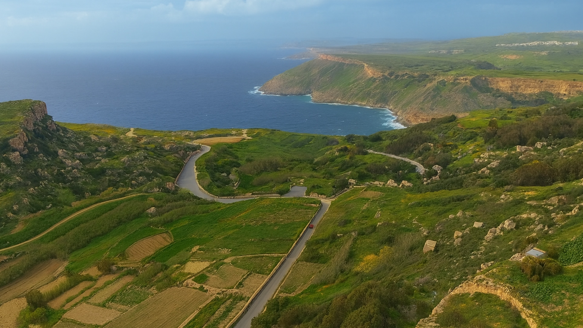 Where Cliffs Rise Behind Village Farms