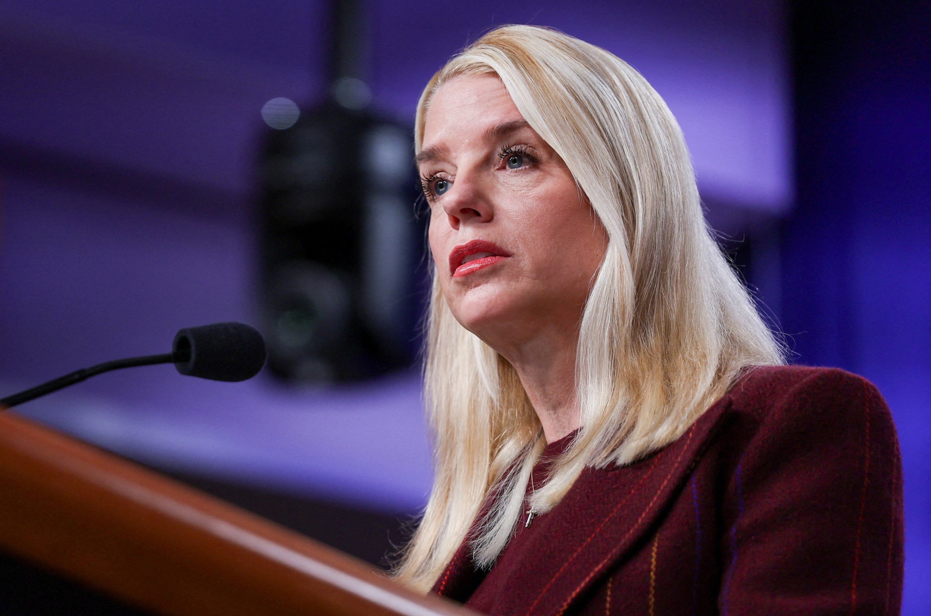 Tom Brenner/Reuters - PHOTO: Attorney General Pam Bondi speaks with reporters during a news conference at the Department of Justice, Nov. 19, 2025, in Washington.