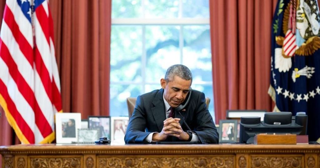 President Obama on the phone with pastors offering a prayer his birthday in 2015.