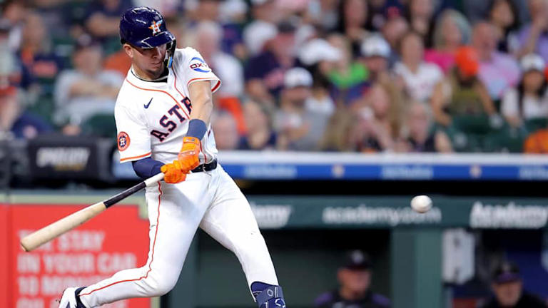 Aug 28, 2025; Houston, Texas, USA; Houston Astros second baseman Ramon Urias (29) hits a single against the Colorado Rockies during the third inning at Daikin Park. | Erik Williams-Imagn Images