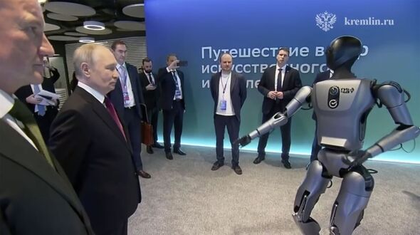 Moment Putin's bodyguards look on in fear as AI dancing robot gets too ...