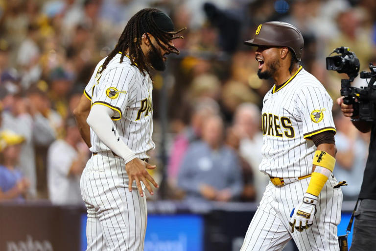 SAN DIEGO, CALIFORNIA – JULY 08: Luis Arraez #4 of the San Diego Padres celebrates his home run with Fernando Tatis Jr. #23 of the San Diego Padres in the seventh inning against the Arizona Diamondbacks at Petco Park on July 08, 2025 in San Diego, California. (Photo by Joe Scarnici/Getty Images)