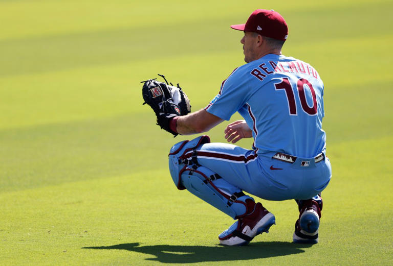 LOS ANGELES, CALIFORNIA – OCTOBER 09: J.T. Realmuto #10 of the Philadelphia Phillies warms up before game four of the National League Division Series against the Los Angeles Dodgers at Dodger Stadium on October 09, 2025 in Los Angeles, California. (Photo by Ronald Martinez/Getty Images)