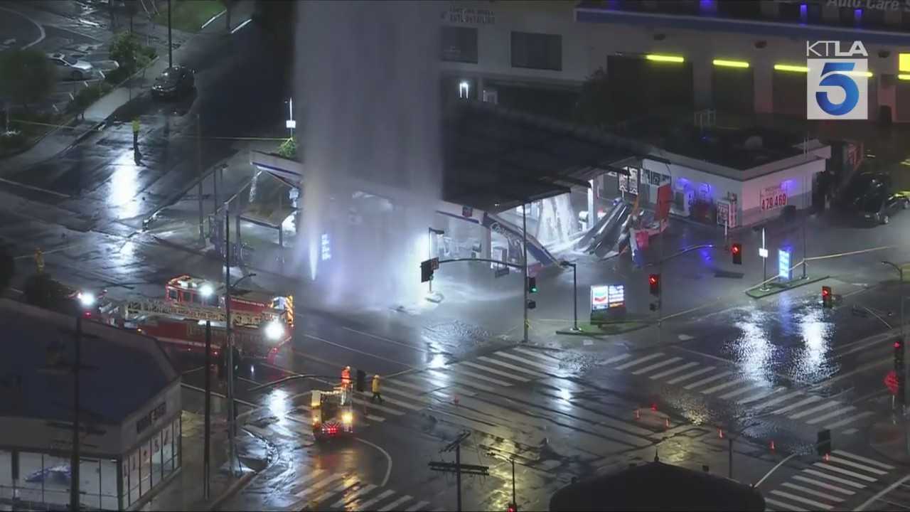 Sheared hydrant geyser collapses Tarzana gas station awning