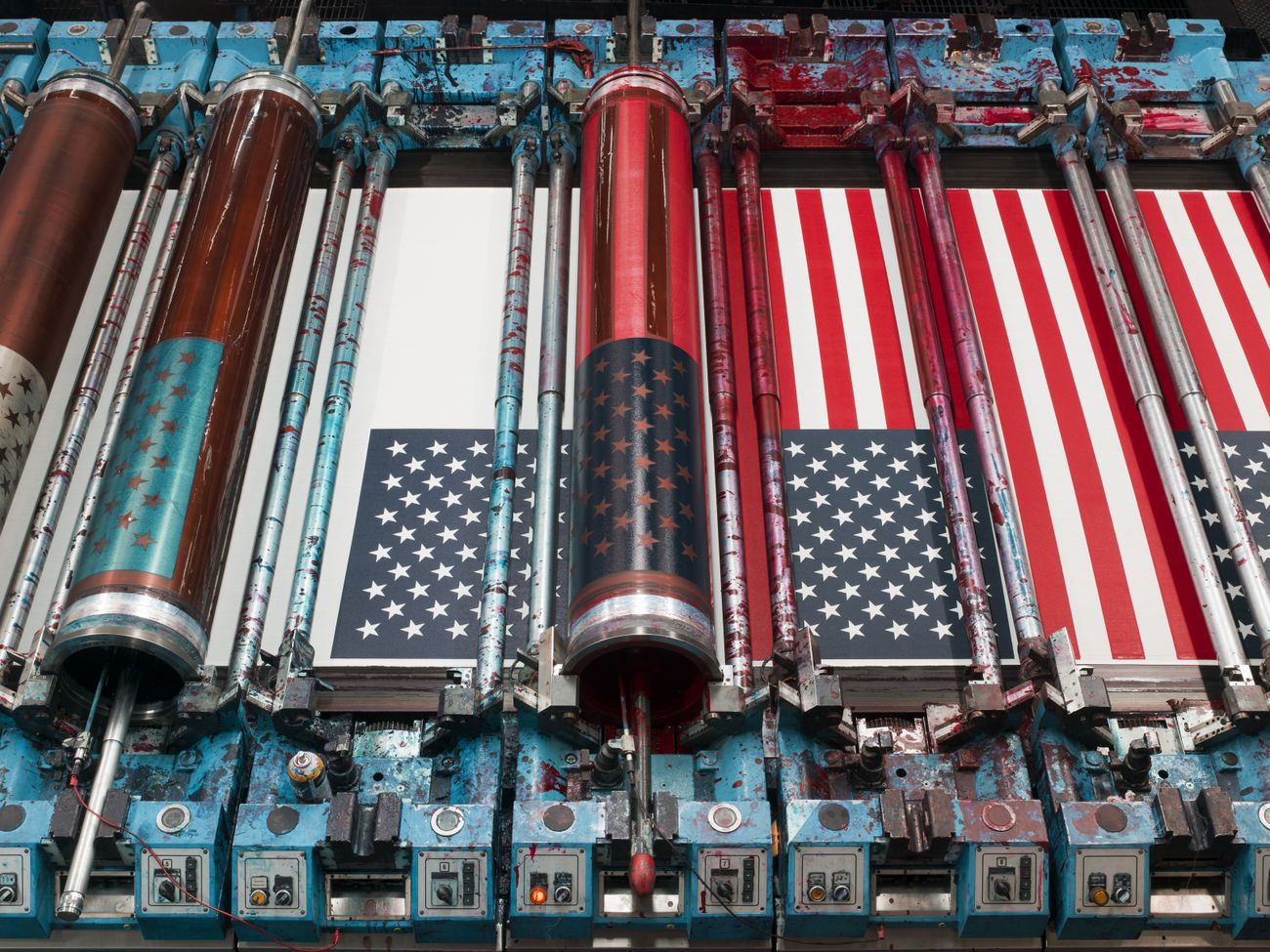 American flags in production on a rotary screen printer at Annin Flagmakers (South Boston, Virginia), 2018