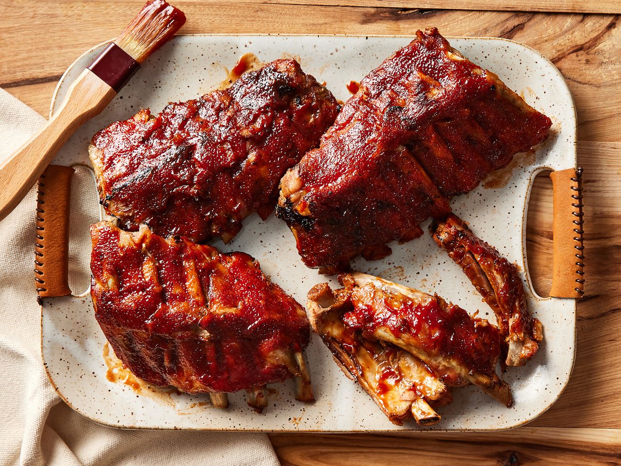 Slowcooked baby back ribs arranged on a serving platter