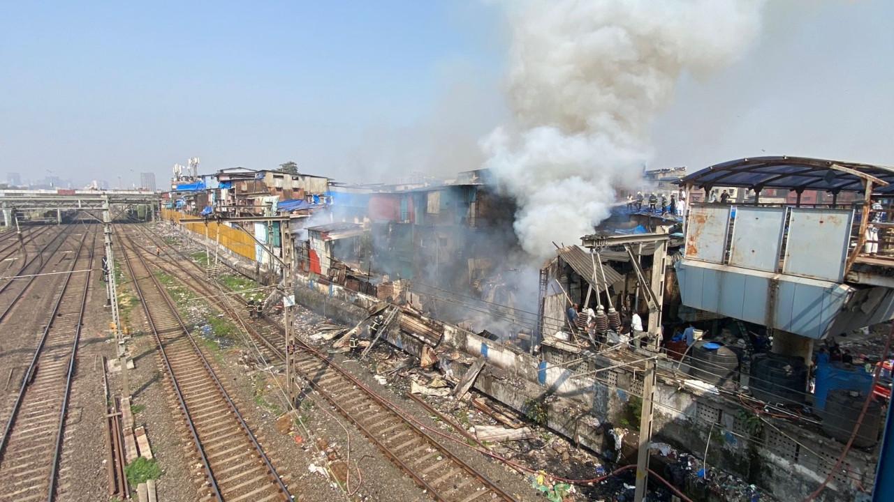 In Photos Major blaze in huts close to Mumbai local train tracks
