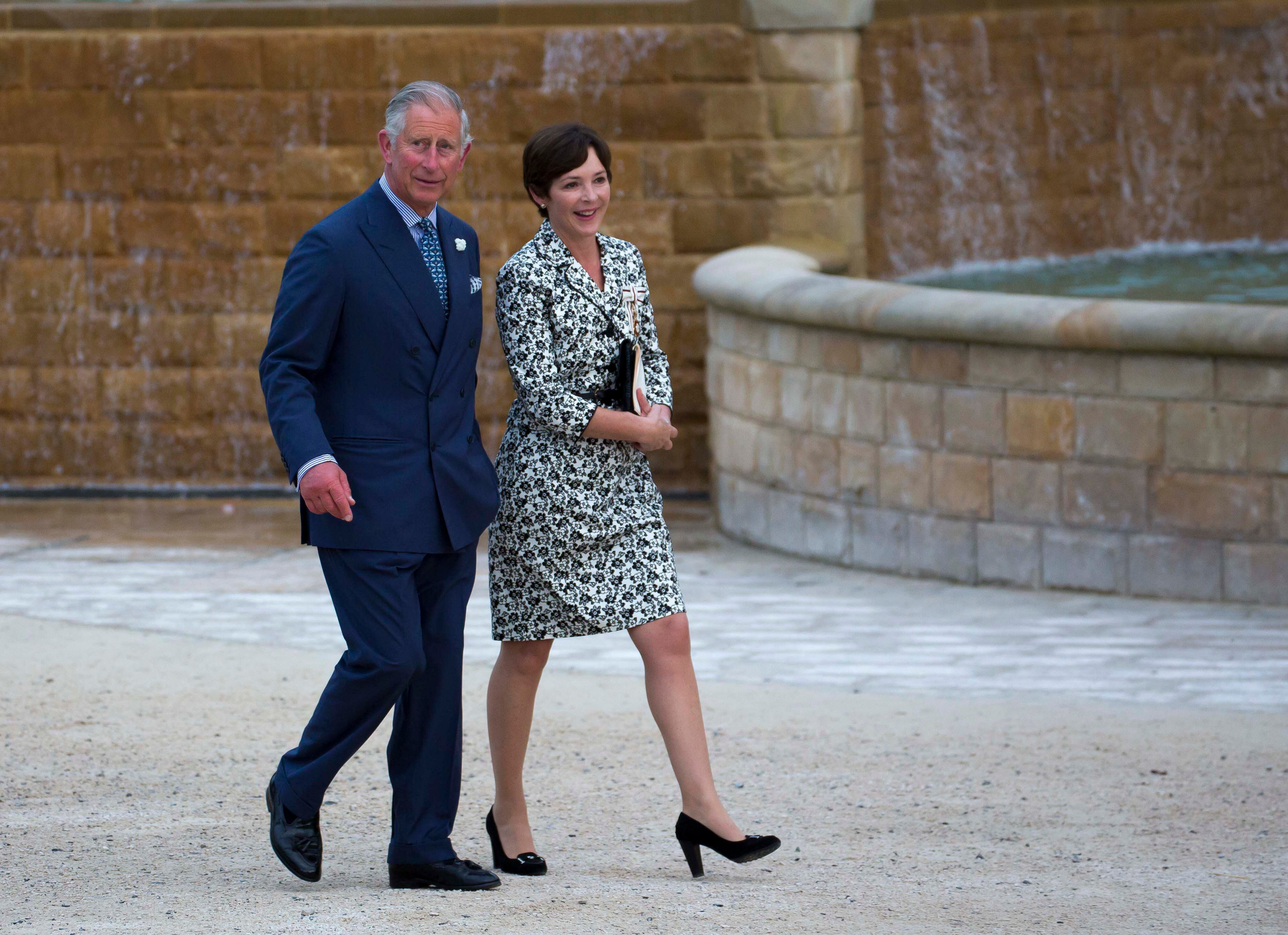 Jane Percy (right) with the then Prince Charles, tours the gardens of Ainwick Castle in 2012. “Unlike other duchesses… I’m not using my title,” she said this week. / Anwar Hussein / Getty Images