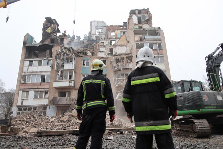 Vlad Kravchuk/AP - PHOTO: Rescue workers clear the rubble of a residential building which was heavily damaged by a Russian strike in Ternopil, Ukraine, on Nov. 21, 2025.