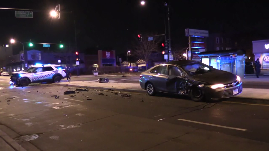 2 officers hurt when driver runs red light, hits CPD squad car in ...