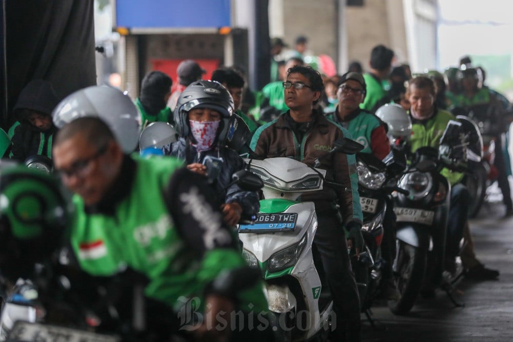 Ancaman Monopoli dan PHK di Balik Kemitraan Grab–Gojek