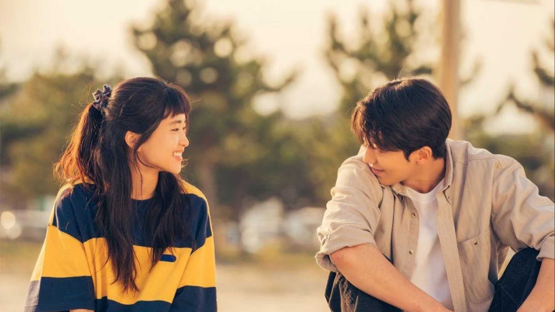 A young woman and a young man smiling at each other in the Twenty-Five Twenty-One K-drama