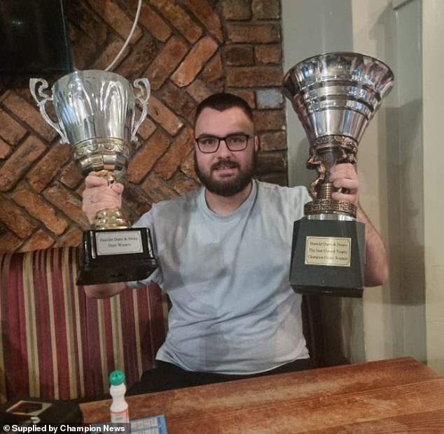 Disabled darts player who amputated his leg after he was hit by ...