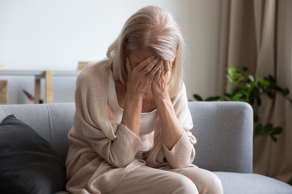 Depressed,Older,Woman,Covering,Face,With,Hands,,Crying,,Feeling,Desperate.