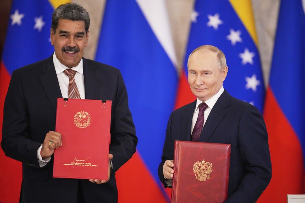 Russian President Vladimir Putin, right, and Venezuelan President Nicolas Maduro pose after a signing ceremony following their talks at the Kremlin in Moscow, Russia, on May 7, 2025.