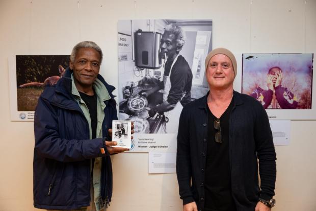 Inspiring image of former homeless man helping community wins ...