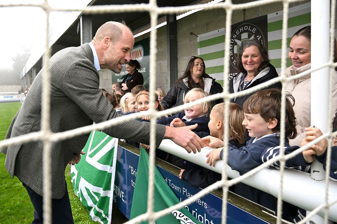 Hugh Hastings/Getty Prince William chatting to young fans and families at Mousehole AFC in Cornwall, on Nov. 13, 2025