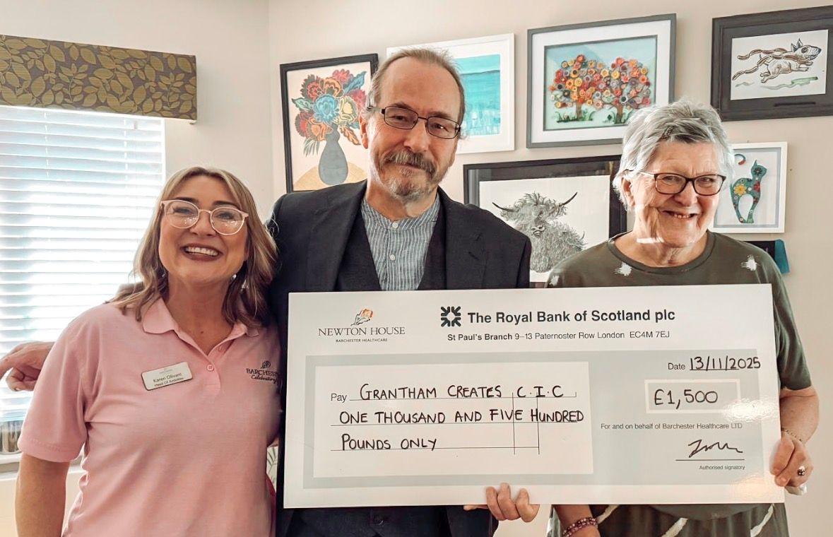 Local care home presents cheque to local charity