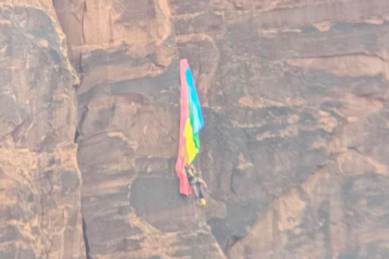 BASE jumper rescued after crashing into cliff and dangling from ...