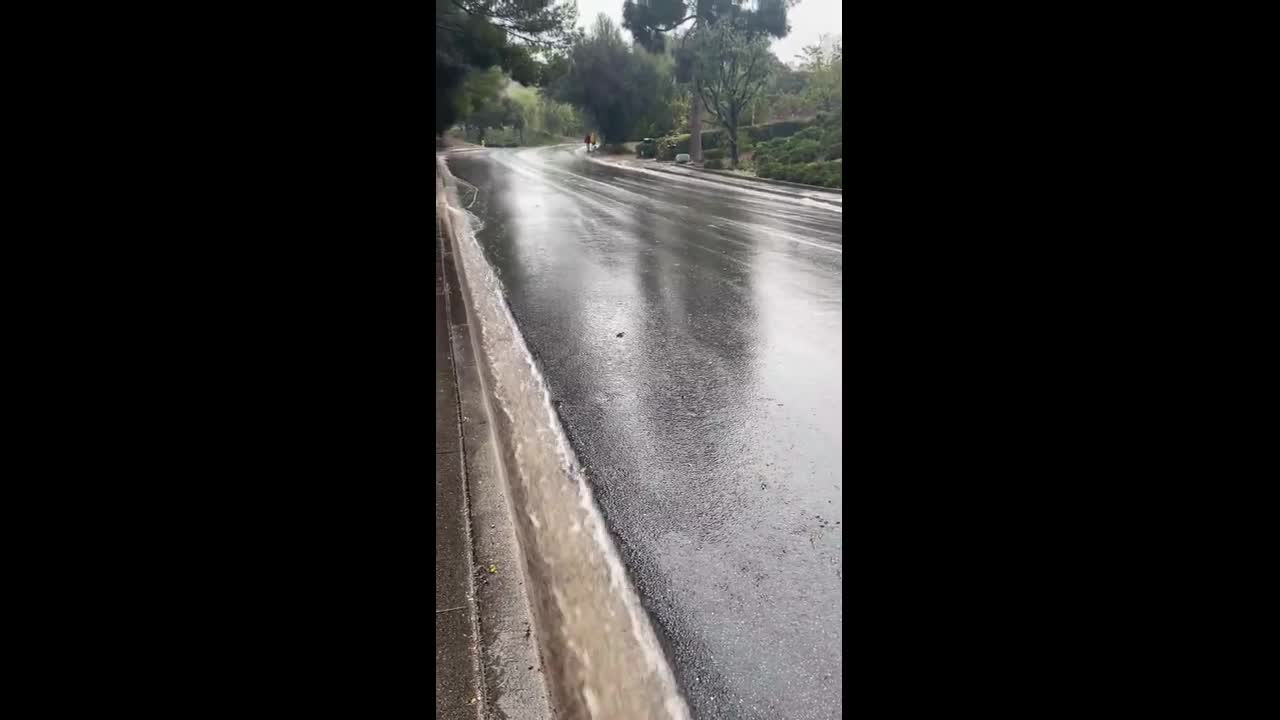 Heavy gutter runoff during continuous rainfall in Thousand Oaks, USA