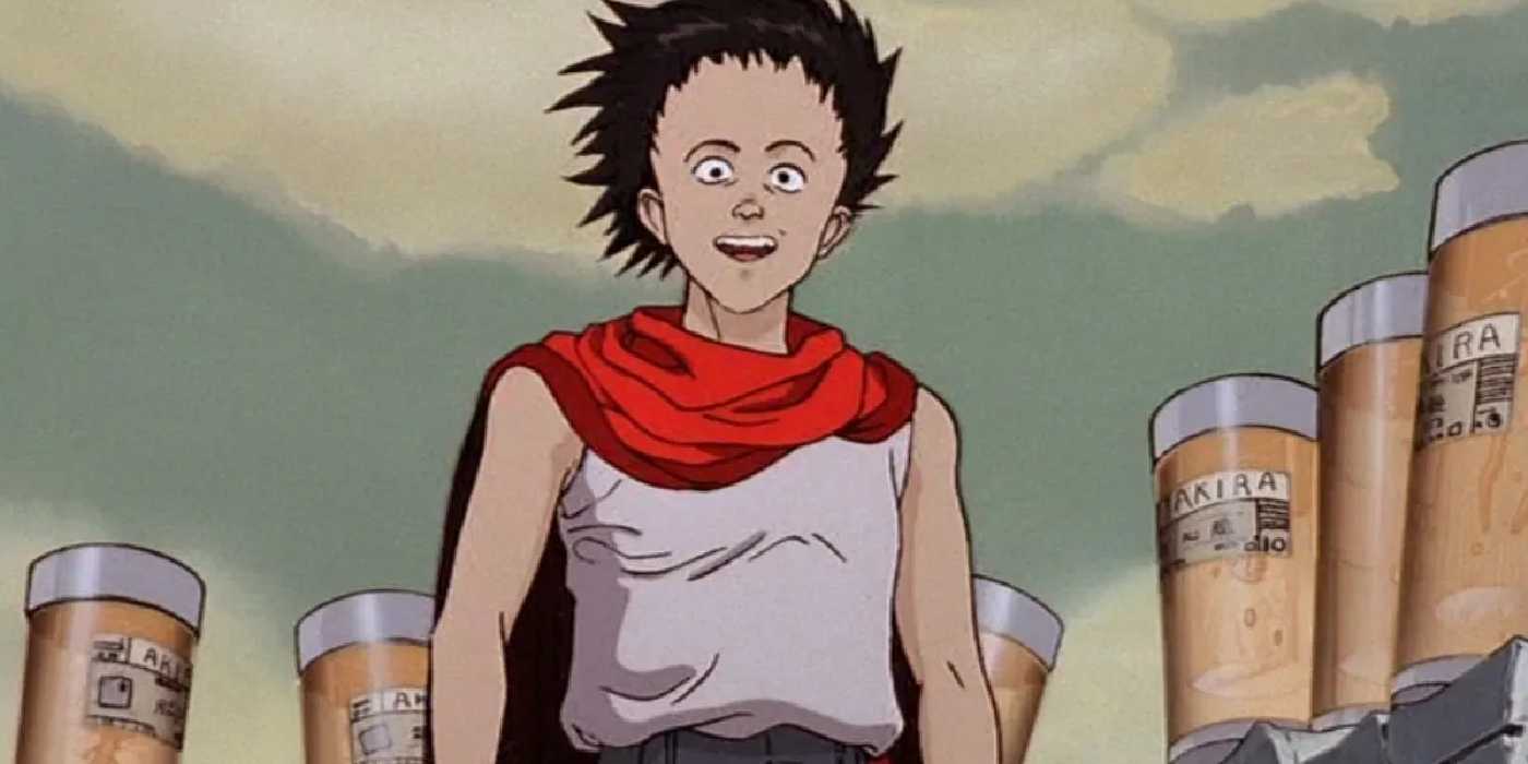 Tetsuo Shima standing and smiling with Akira's parts behind him.