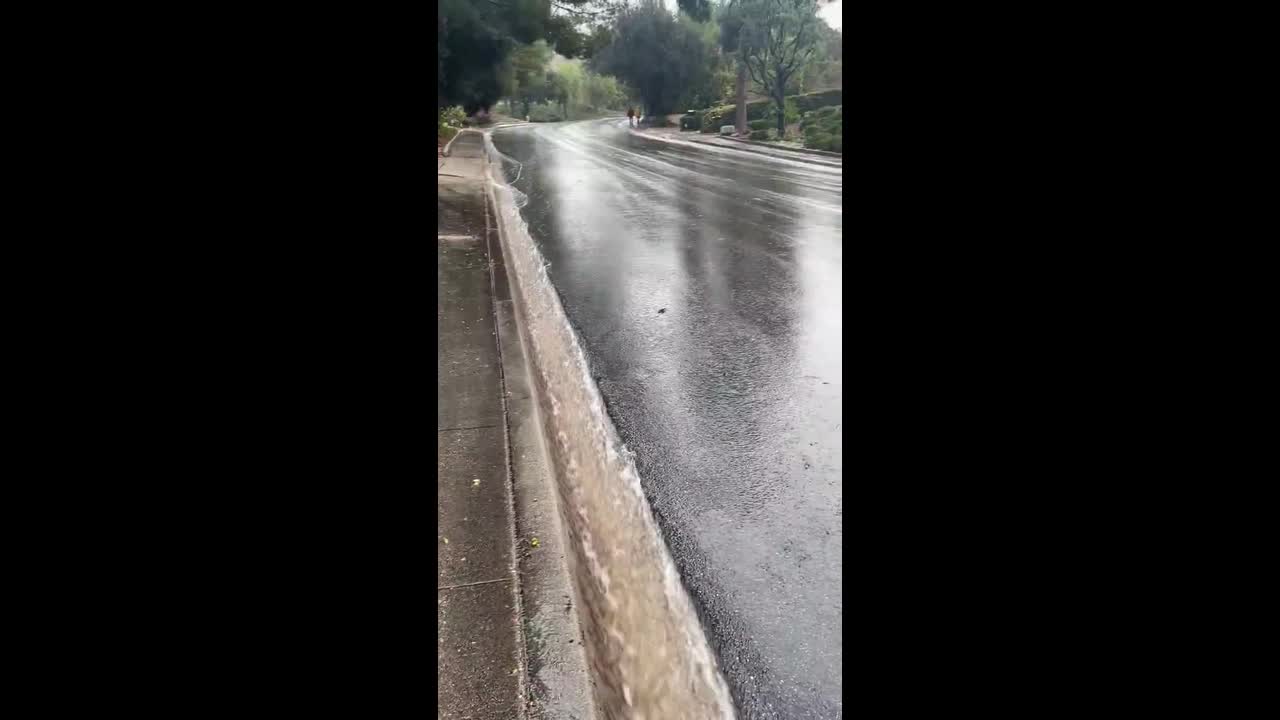 Heavy gutter runoff during continuous rainfall in Thousand Oaks, USA