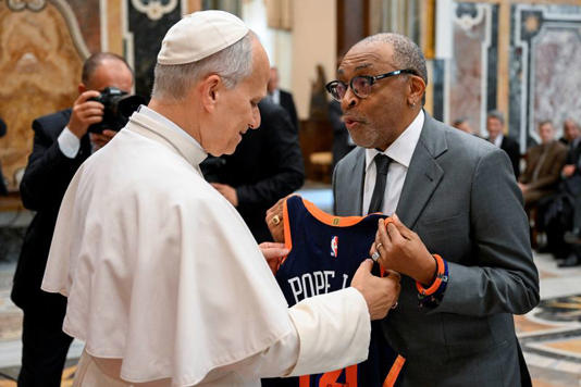 Pope Leo XIV meets with filmmaker Spike Lee, during an audience with artists from the world of cinema in the Sala Clementina at the Vatican, November 15, 2025, in this handout image. Simone Risoluti/Vatican Media/­Handout via REUTERS