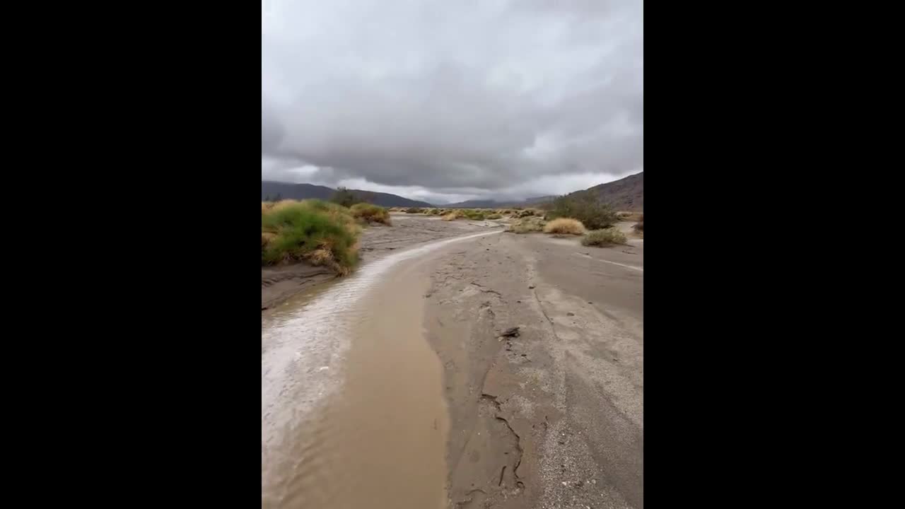 Minor flash flooding rushes through Coyote Canyon in California, USA