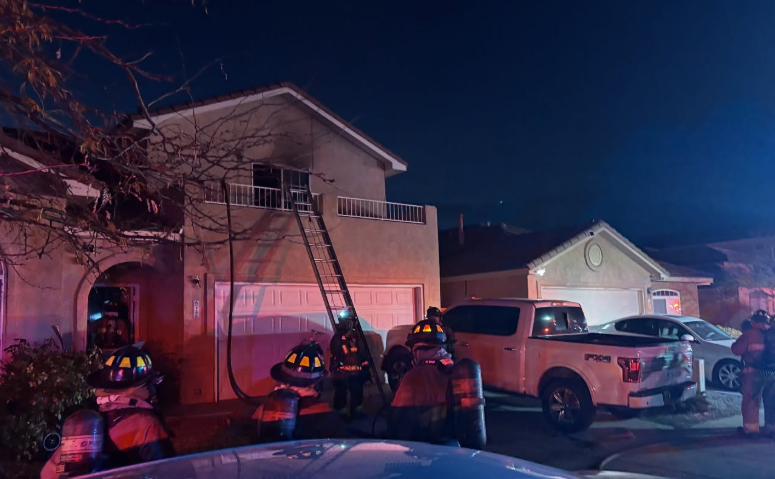 Firefighters rescue 3 from balcony of 2-story house