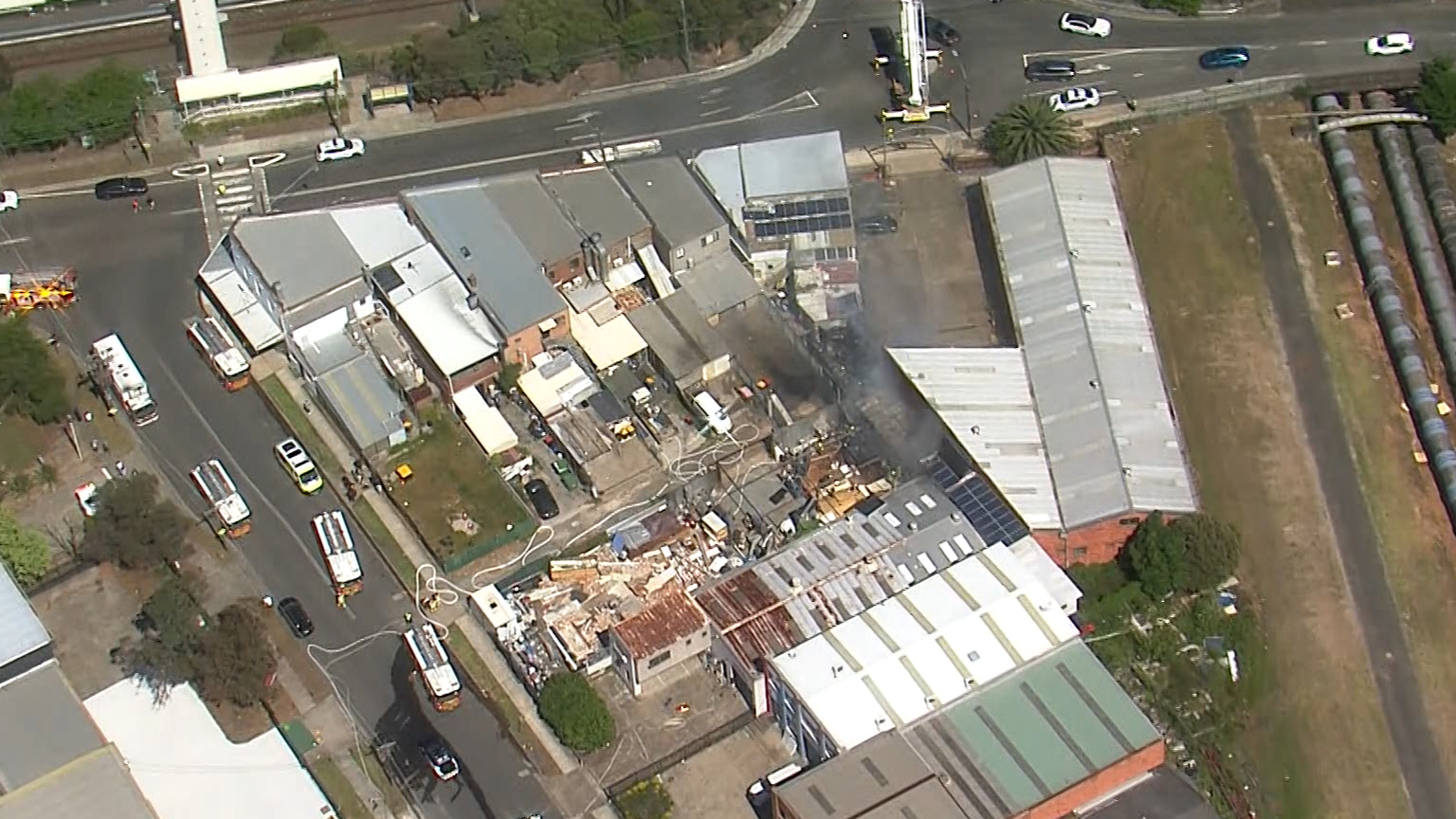 Dozens of firefighters battle blaze at furniture factory in Sydney's west