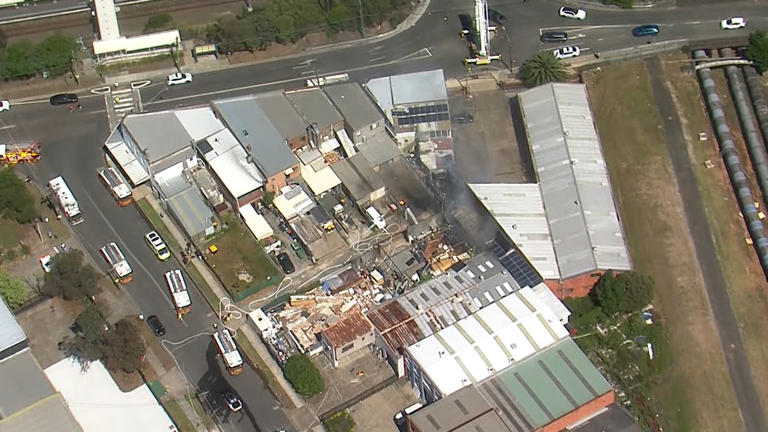 Dozens of firefighters battle blaze at furniture factory in Sydney's west