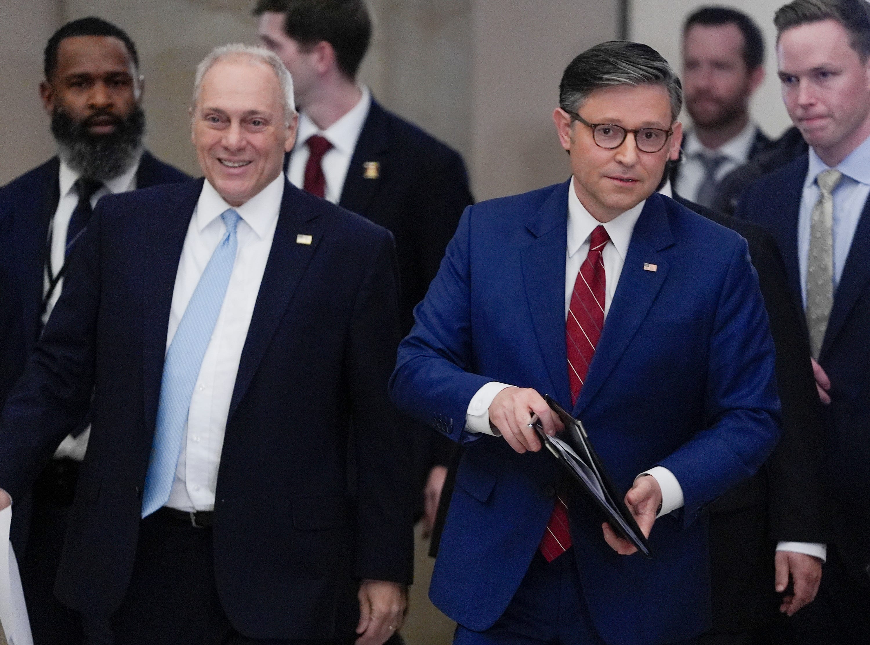 House Speaker Mike Johnson, right, walks from the House floor with House Majority Leader Steve Scalise (R-LA), left, to speak with the media in Statuary Hall immediately after the House voted 222-209 to pass the Senate's funding deal on Wednesday, Nov. 12, 2025.