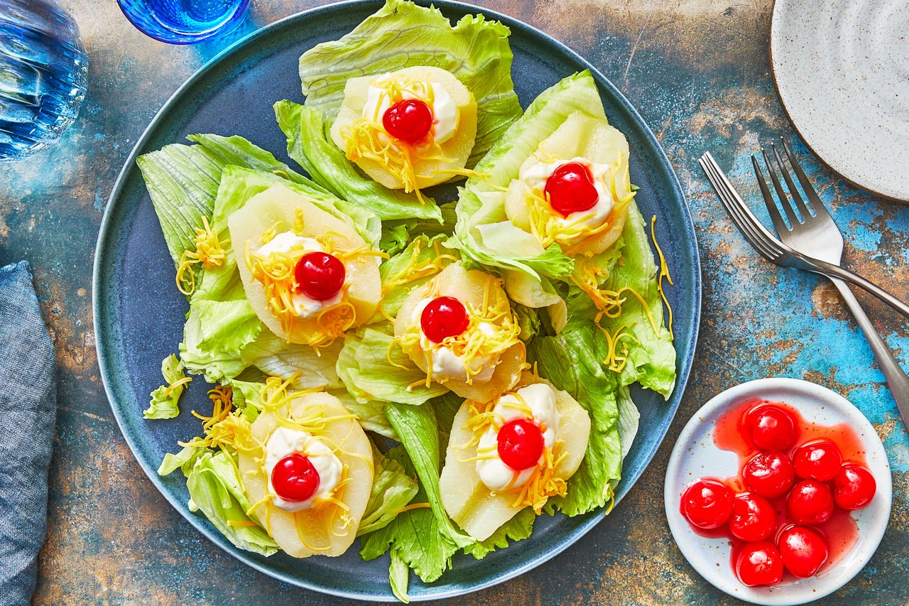 Pear salads with mayonnaise, lettuce, cheese, and cherries - Southern Living
