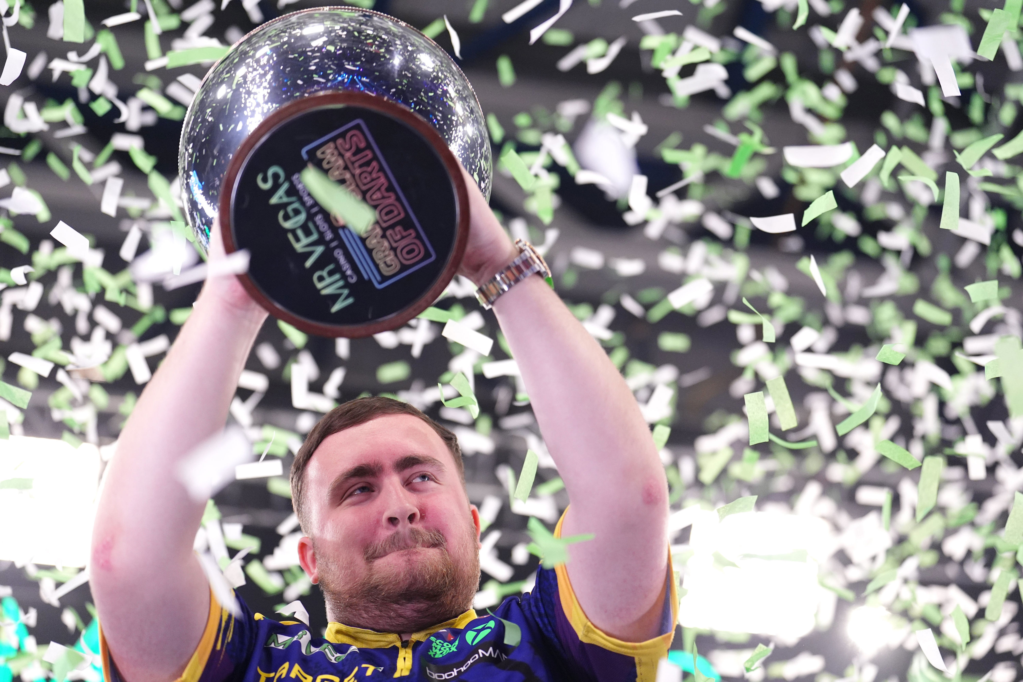 Luke Littler celebrates world number one status by retaining Grand Slam ...