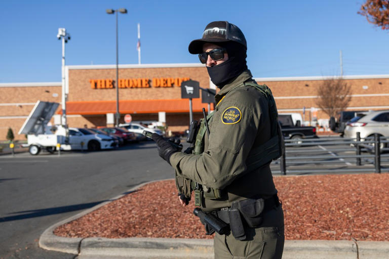 A U.S. Border Patrol agent stands outside a Home Depot store on November 19, 2025, in Charlotte, North Carolina. (John Moore/Getty Images)