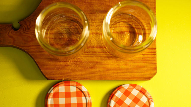 Turn Old Jars Into Beautiful Countertop Storage With An Easy DIY Lid Hack