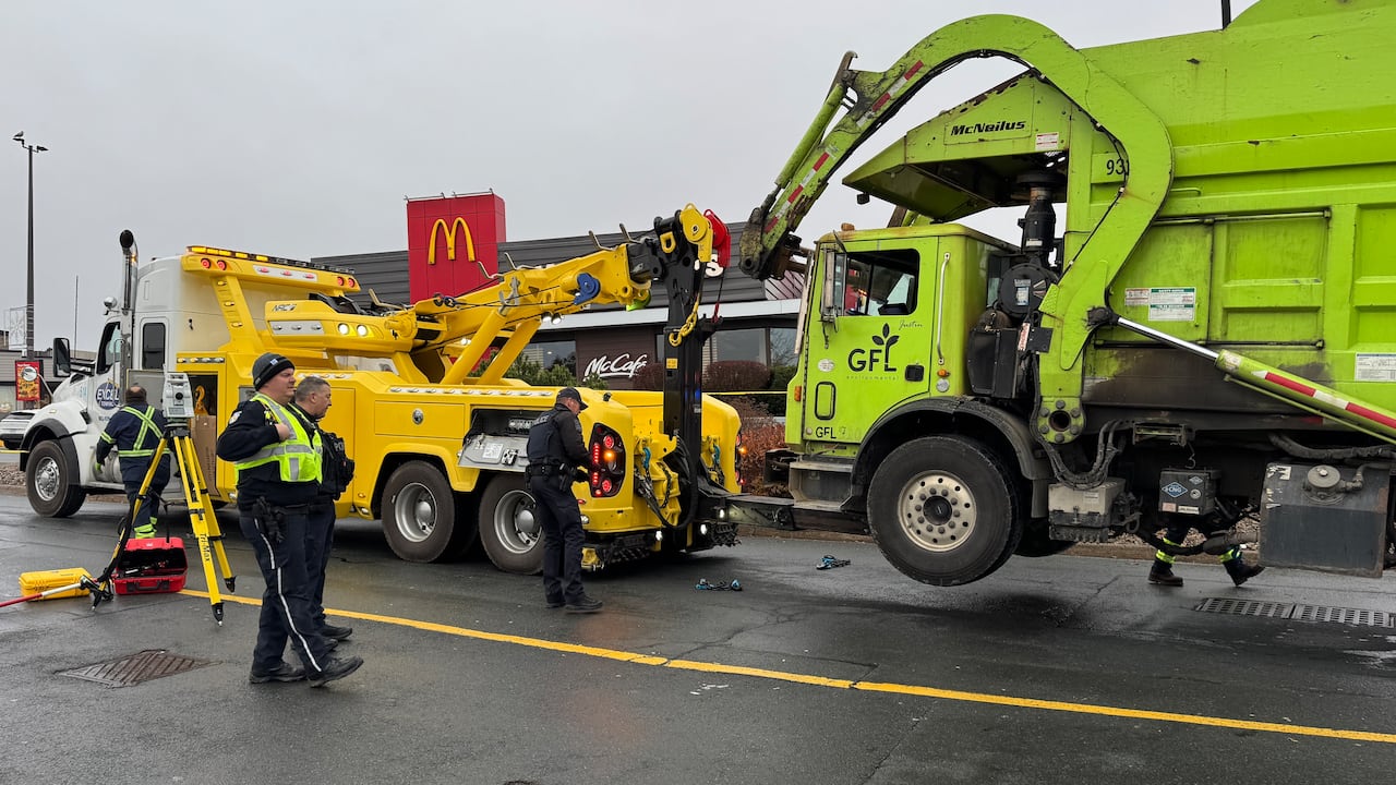 Woman, 34, seriously injured after being hit by garbage truck