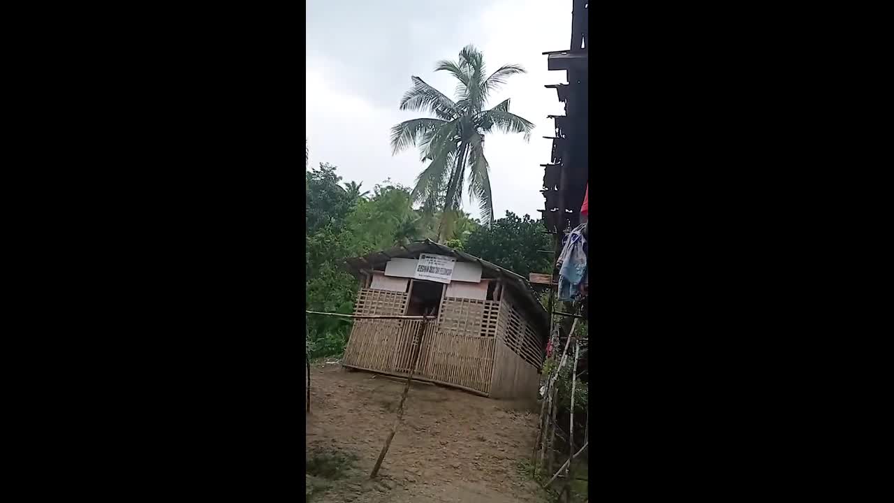 Terrified locals hide inside during firefight between communist rebels