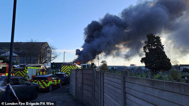 Huge fire tears through warehouse as 150 firefighters rush to fight blaze