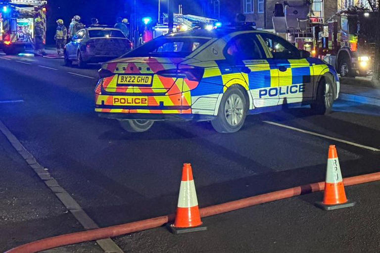 Police close road as firefighters put out house fire in Leicester suburb