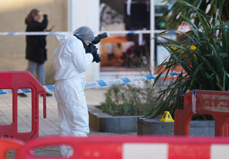 Forensics pictured at West Sussex railway station after young man ...